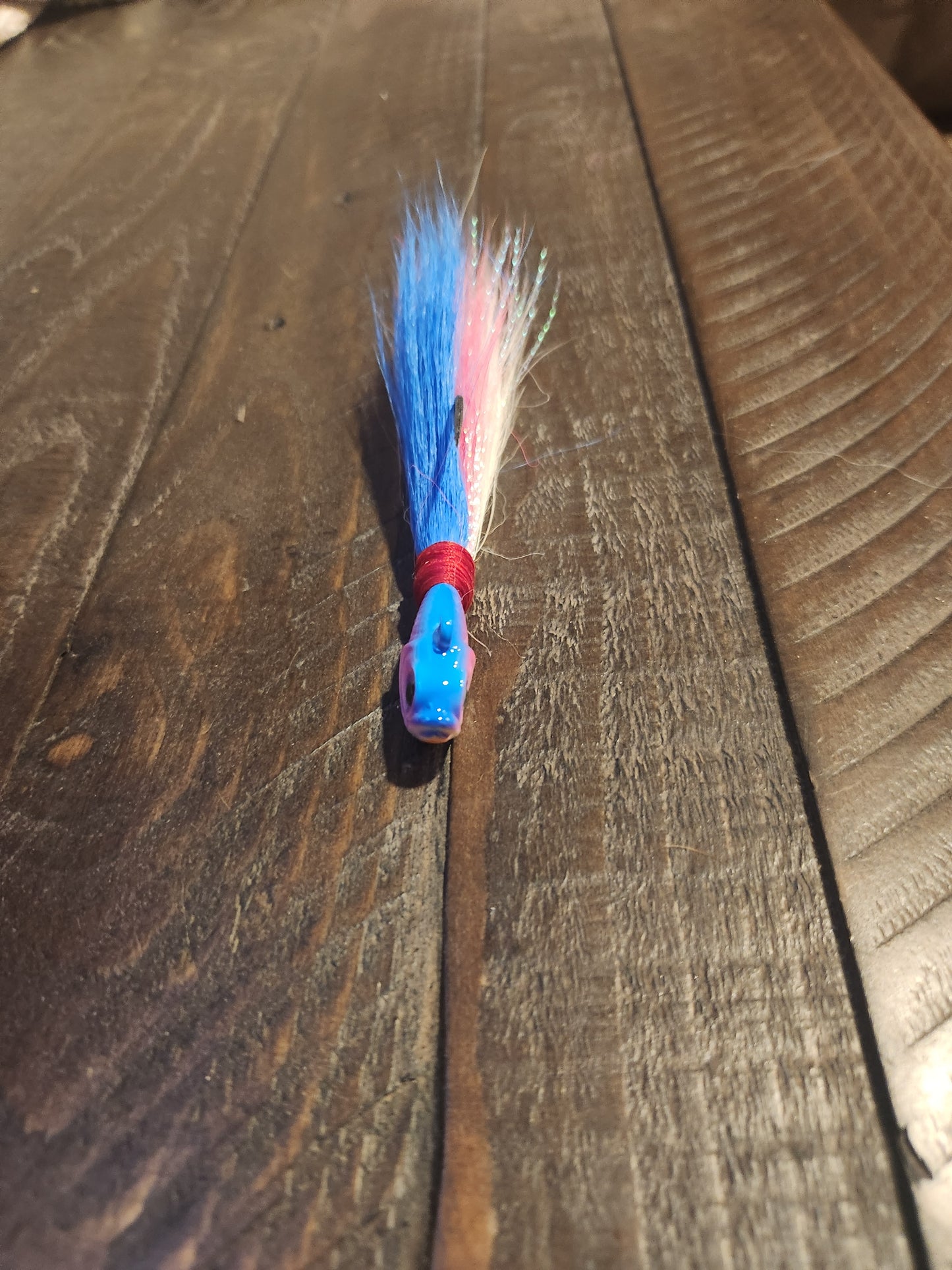 Bucktail jig, 30g, pink/blue/white, pink/white face. $5.99